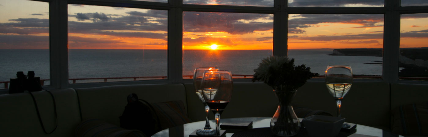 Watch the sunset from the lantern room of the Belle Tout Lighthouse at Beachy Head